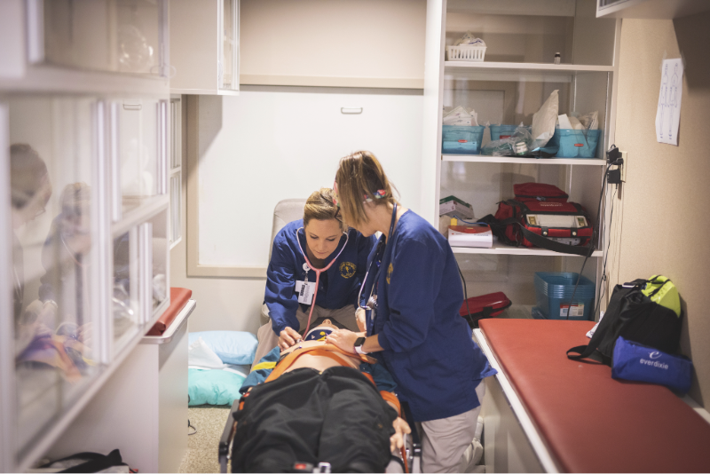 EMTs work on a mannequin