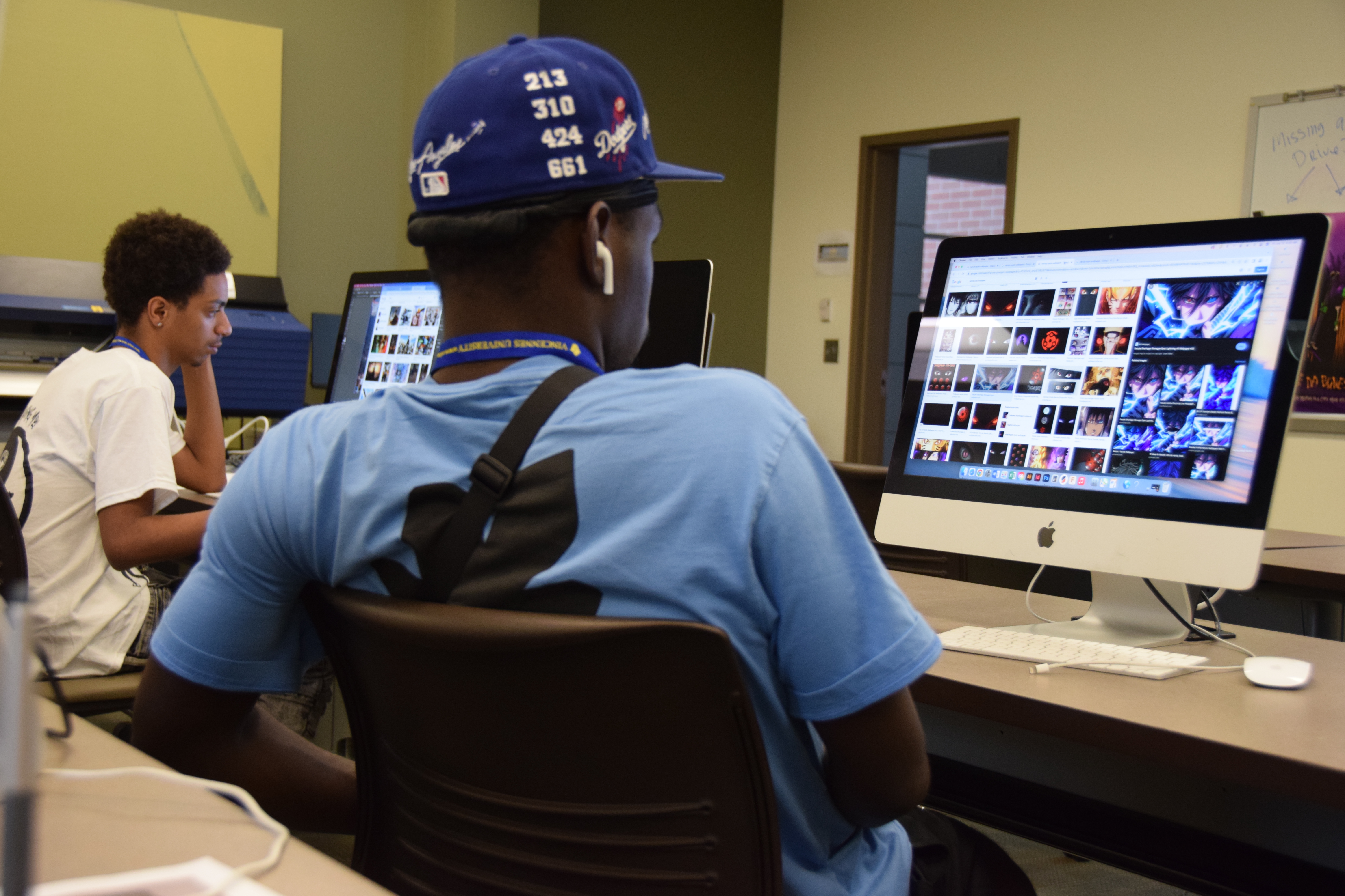 Student working on desktop computer.